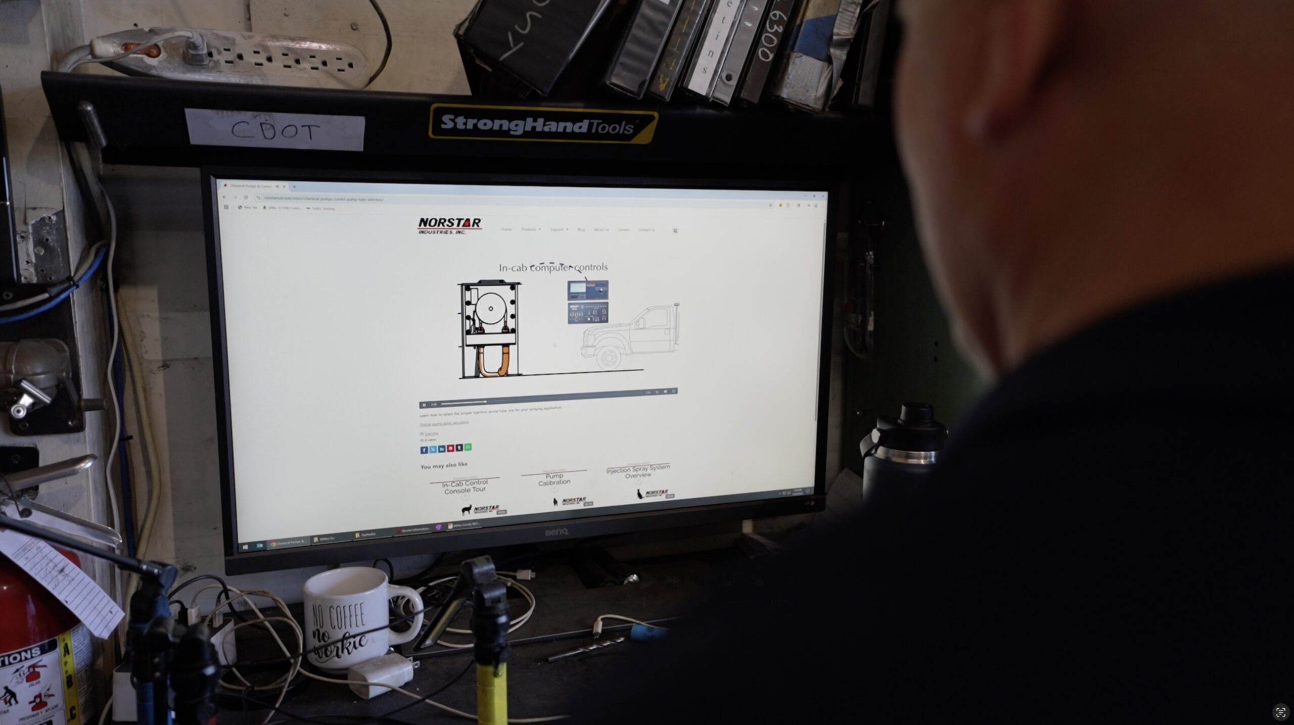 Tracey Kelly watching a Norstar video on a computer monitor